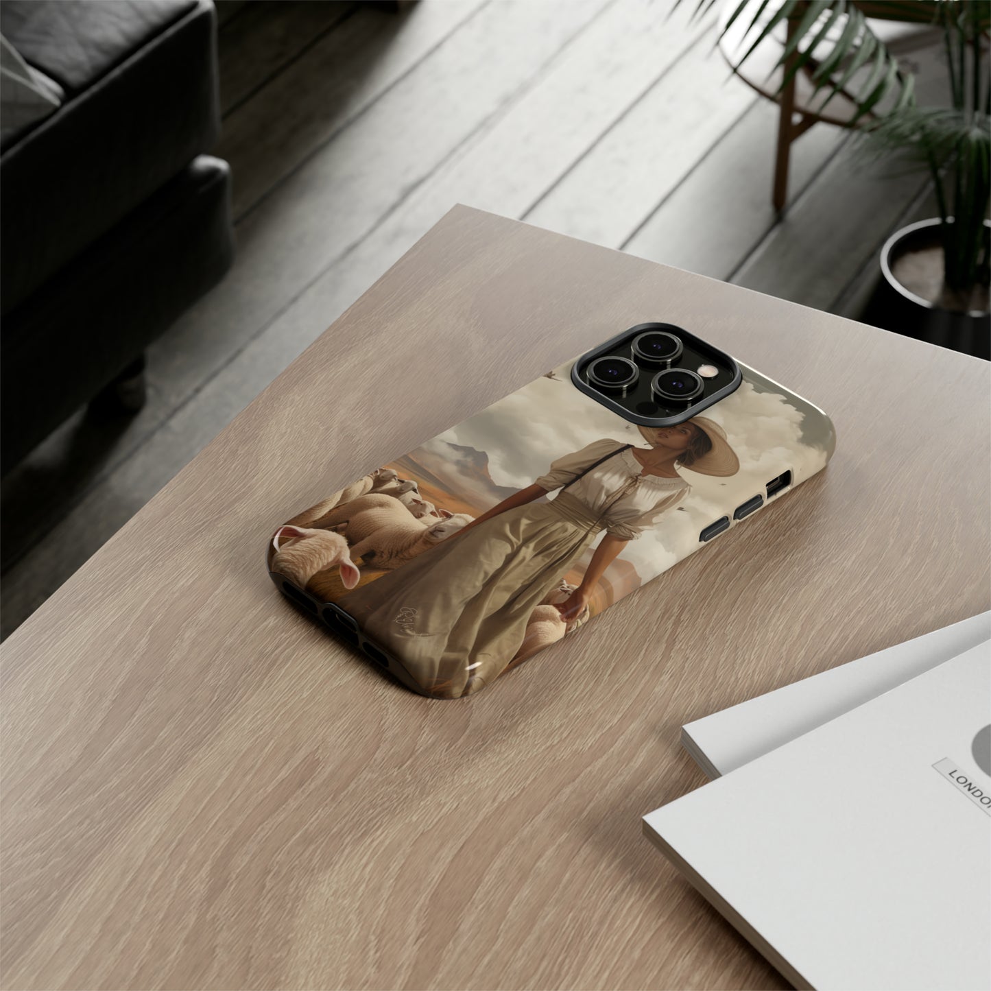 Immerse yourself in a dreamy landscape with our Tough Western Cell Phone Case showcasing a vintage painted design of a woman wearing a hat, walking through a prairie landscape with sheep behind her. Experience the magic of the past with this edition.
