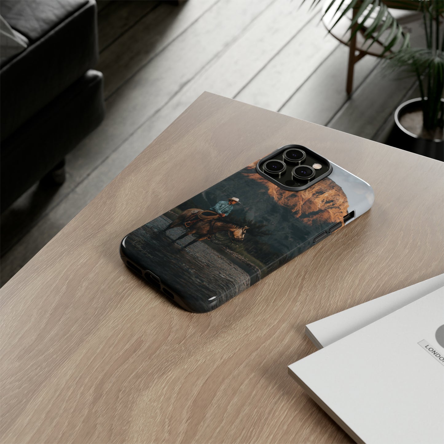 Capture the Wild: Horse Art Western Photo Yellowstone Design iPhone Tough Protective Cover. Featuring a Cowboy amidst Mountains and Buckskin hues, compatible with iPhone 15, 14, 13, XS, XR Pro/Max/Mini/P/Plus. Embrace the Spirit of the West with Style and Durability. #ElizaSinger #PhoneCase #WesternDesign