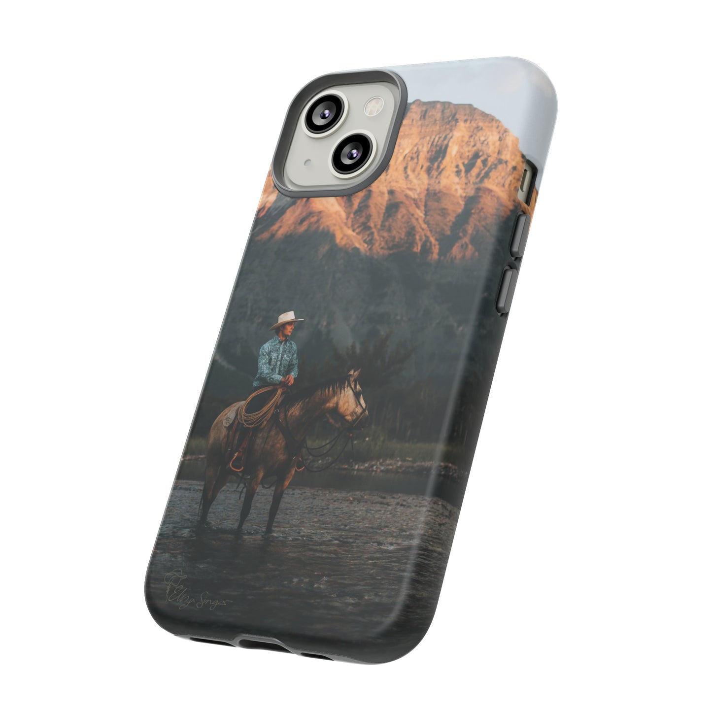 Capture the Wild: Horse Art Western Photo Yellowstone Design iPhone Tough Protective Cover. Featuring a Cowboy amidst Mountains and Buckskin hues, compatible with iPhone 15, 14, 13, XS, XR Pro/Max/Mini/P/Plus. Embrace the Spirit of the West with Style and Durability. #ElizaSinger #PhoneCase #WesternDesign