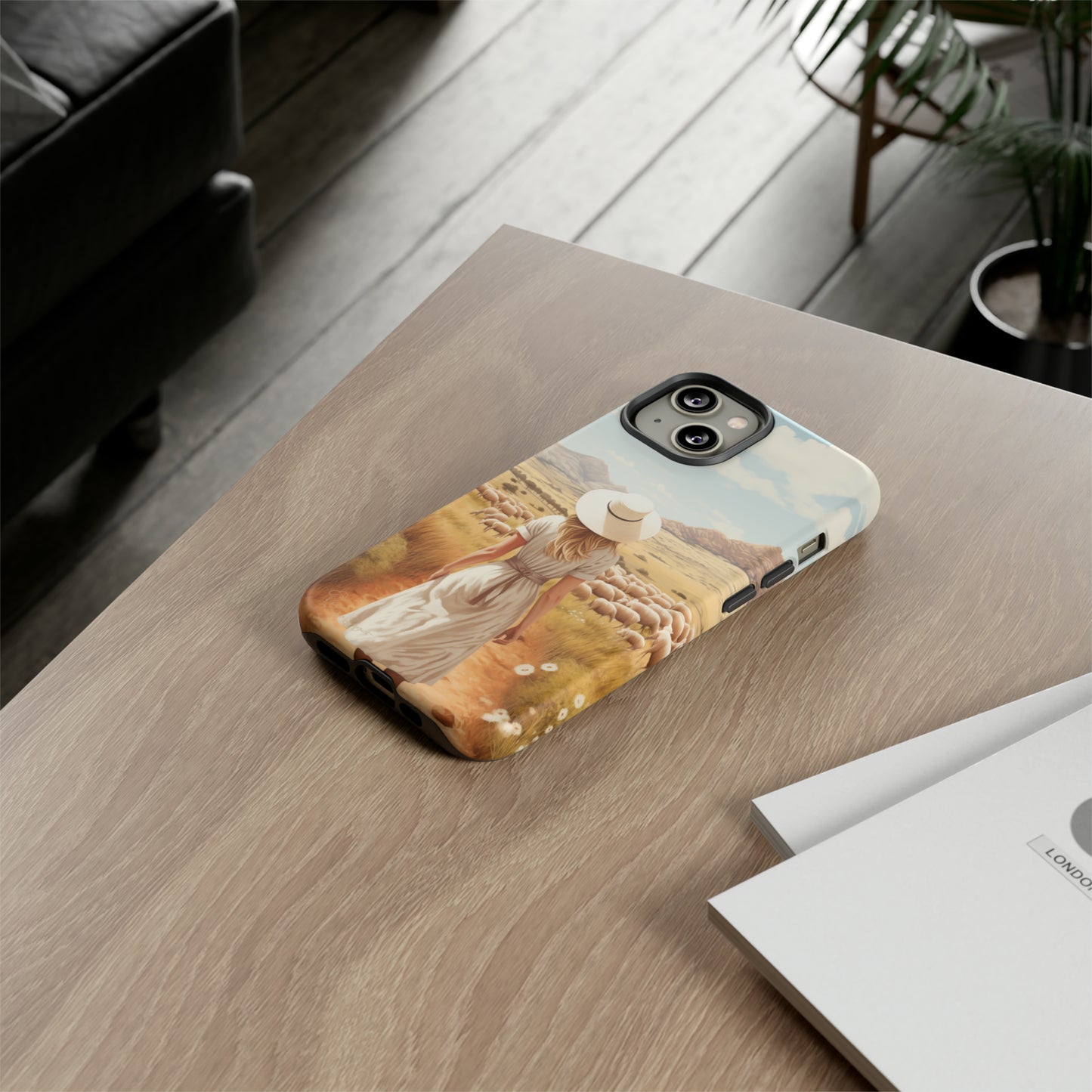 Dreamy Nostalgia: Immerse yourself in a vintage painted landscape with our Tough Western Cell Phone Case. Adorned with a woman in a hat strolling through a prairie with sheep, this edition captures the magic of the past. Elevate your phone with timeless charm. #ElizaSinger #PhoneCase
