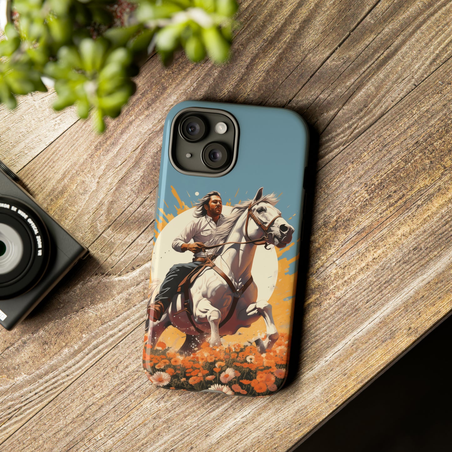 Retro Radiance Unleashed: Behold our Tough Western Cell Phone Case, featuring a vintage white horse and male rider on a vibrant turquoise backdrop. Set in a field of flowers with the sun casting a warm glow, this edition seamlessly blends style with protection. Embrace the past with this retro and stylish accessory. #ElizaSinger #PhoneCase #RetroRadiance
