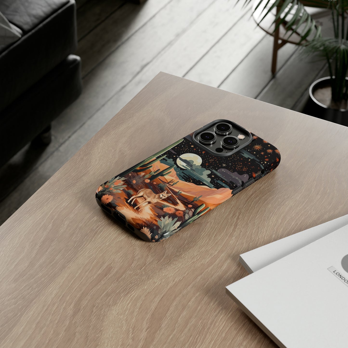 Introducing our Tough Western Cell Phone Case: Twilight Desert Jackal Remix Edition! A variation of our popular design, this edition features a jackal in a desert landscape with a starry night sky and cacti. Get ready for a unique twist on classic rugged protection.