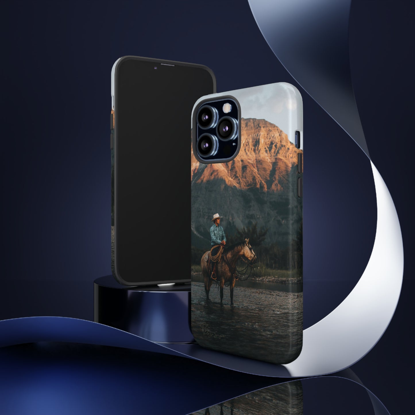 Capture the Wild: Horse Art Western Photo Yellowstone Design iPhone Tough Protective Cover. Featuring a Cowboy amidst Mountains and Buckskin hues, compatible with iPhone 15, 14, 13, XS, XR Pro/Max/Mini/P/Plus. Embrace the Spirit of the West with Style and Durability. #ElizaSinger #PhoneCase #WesternDesign