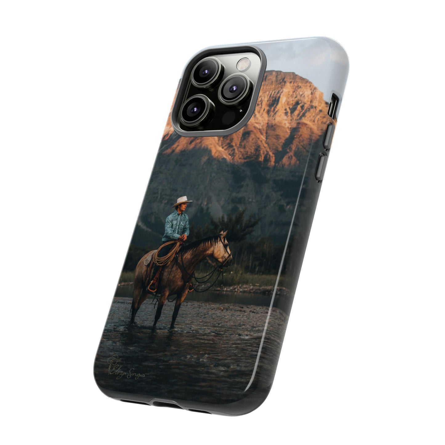 Capture the Wild: Horse Art Western Photo Yellowstone Design iPhone Tough Protective Cover. Featuring a Cowboy amidst Mountains and Buckskin hues, compatible with iPhone 15, 14, 13, XS, XR Pro/Max/Mini/P/Plus. Embrace the Spirit of the West with Style and Durability. #ElizaSinger #PhoneCase #WesternDesign