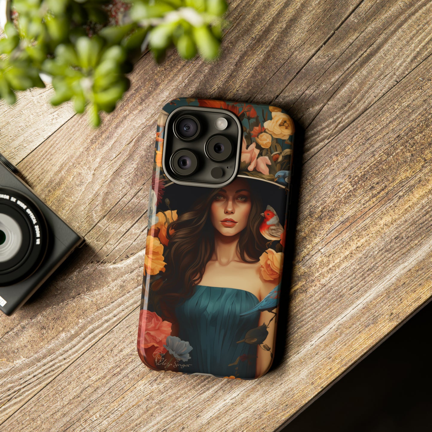 Dark Elegance Unveiled: Explore our Tough Cell Phone Case with a captivating dark background and a woman adorned with a hat amid blooming flowers. This edition seamlessly blends sophistication with robust protection, showcasing the allure of dark elegance. Elevate your style and shield your device. #ElizaSinger #PhoneCase #ElegantProtection