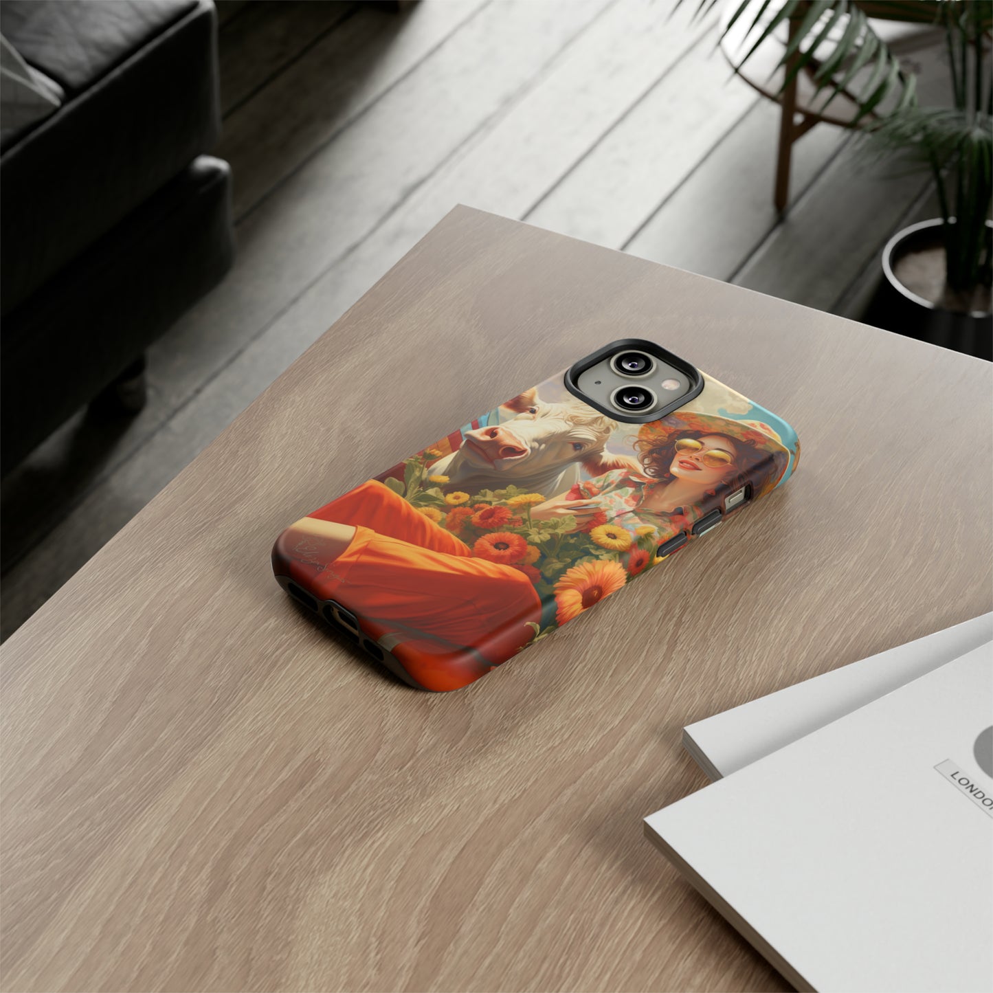Timeless Retro Charm: Step back in time with our Tough Western Cell Phone Case. Featuring a vintage and bright design, a woman in a hat with daisies is accompanied by a cow looking over her shoulder. Experience the perfect blend of retro aesthetics and durability. Elevate your style with a touch of nostalgia. #ElizaSinger #PhoneCase #RetroStyle