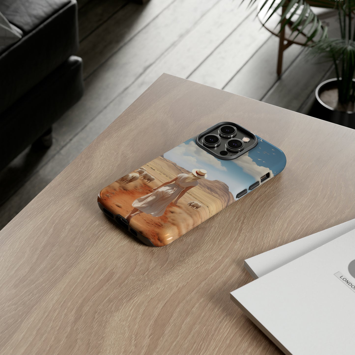 Serenity in Hand: Our Tough Western Cell Phone Case invites you to experience tranquility. A vintage painted design portrays a woman in a skirt and hat walking on a dirt road through a prairie, with grazing sheep. Let the vanishing horizon captivate your senses. Elevate your phone with timeless beauty. #ElizaSinger #PhoneCase