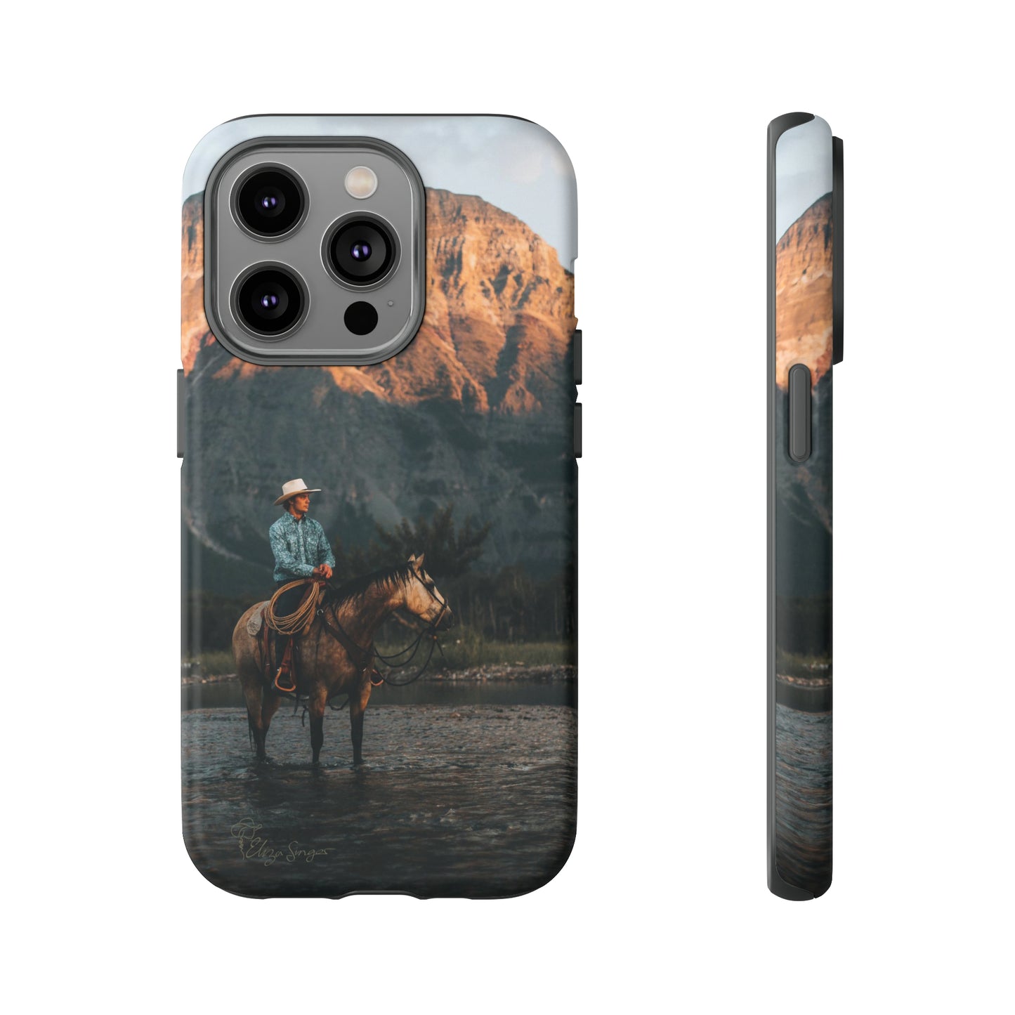 Capture the Wild: Horse Art Western Photo Yellowstone Design iPhone Tough Protective Cover. Featuring a Cowboy amidst Mountains and Buckskin hues, compatible with iPhone 15, 14, 13, XS, XR Pro/Max/Mini/P/Plus. Embrace the Spirit of the West with Style and Durability. #ElizaSinger #PhoneCase #WesternDesign