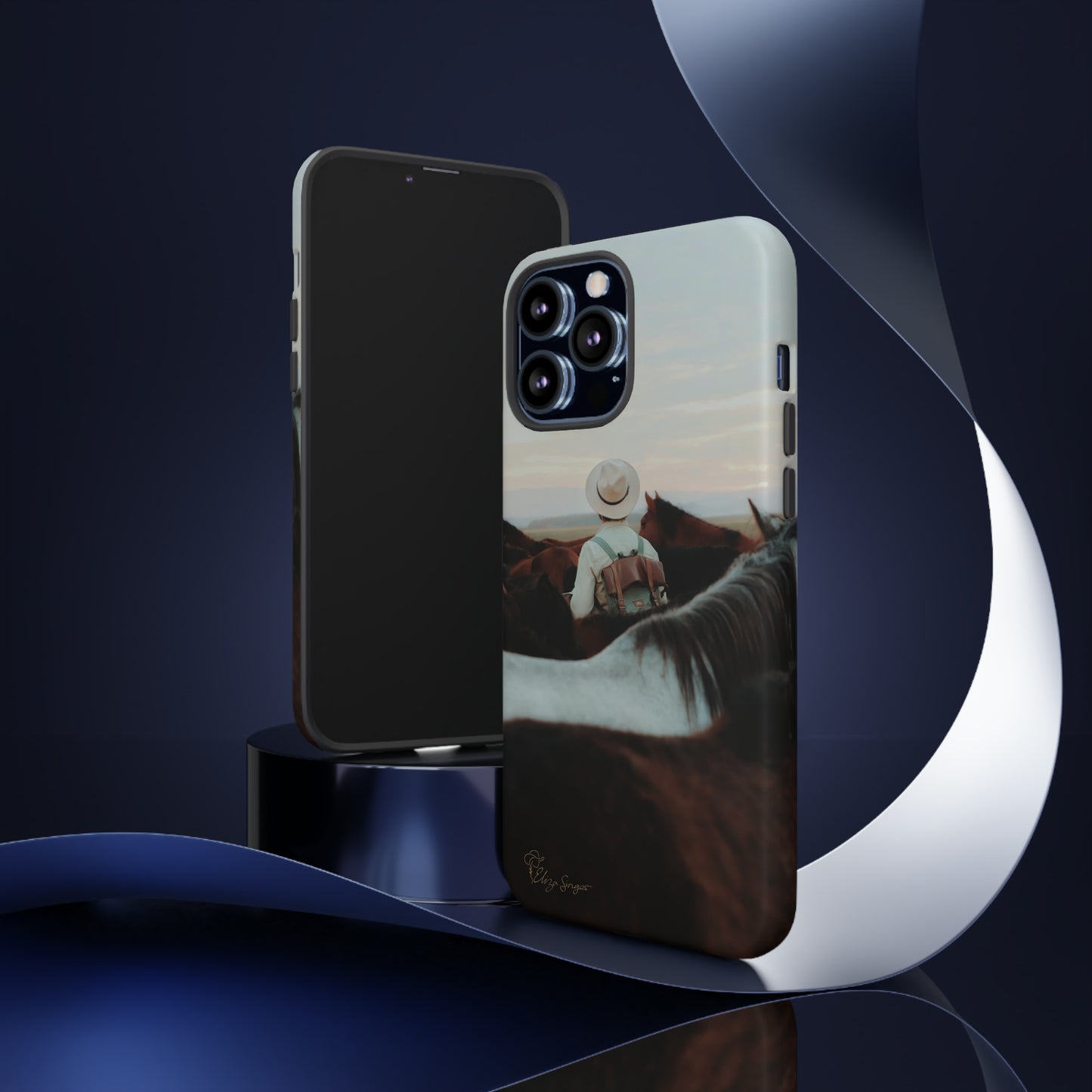 Ride into the Wild: Horse Art Western Photo Yellowstone Design iPhone Tough Protective Cover. Featuring a Cowboy amidst Mountains and Buckskin hues. Compatible with iPhone 15, 14, 13, XS, XR Pro/Max/Mini/P/Plus. Embrace the Spirit of the West with Style and Durability. #ElizaSinger #PhoneCase #WesternDesign