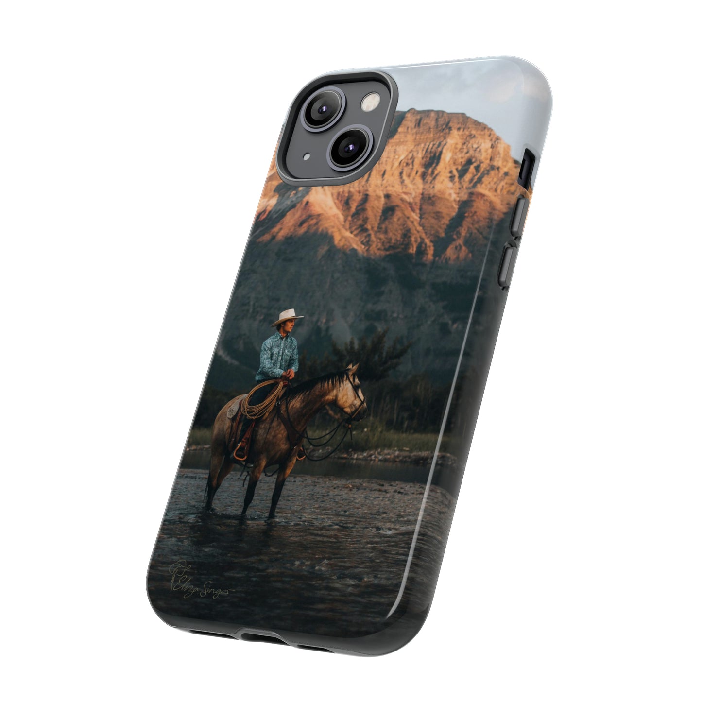 Capture the Wild: Horse Art Western Photo Yellowstone Design iPhone Tough Protective Cover. Featuring a Cowboy amidst Mountains and Buckskin hues, compatible with iPhone 15, 14, 13, XS, XR Pro/Max/Mini/P/Plus. Embrace the Spirit of the West with Style and Durability. #ElizaSinger #PhoneCase #WesternDesign