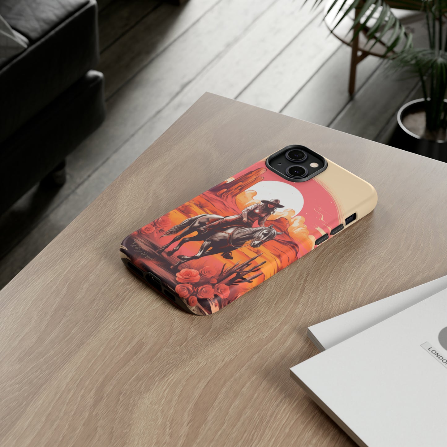 Feminine Adventure Unleashed: Introducing our Tough Western Cell Phone Case, adorned with a stunning design of a cowgirl riding a horse through the desert, surrounded by shades of coral. This unique edition seamlessly combines rugged protection with a touch of feminine flair. Elevate your style with a dash of adventurous charm. #ElizaSinger #PhoneCase #FeminineAdventure