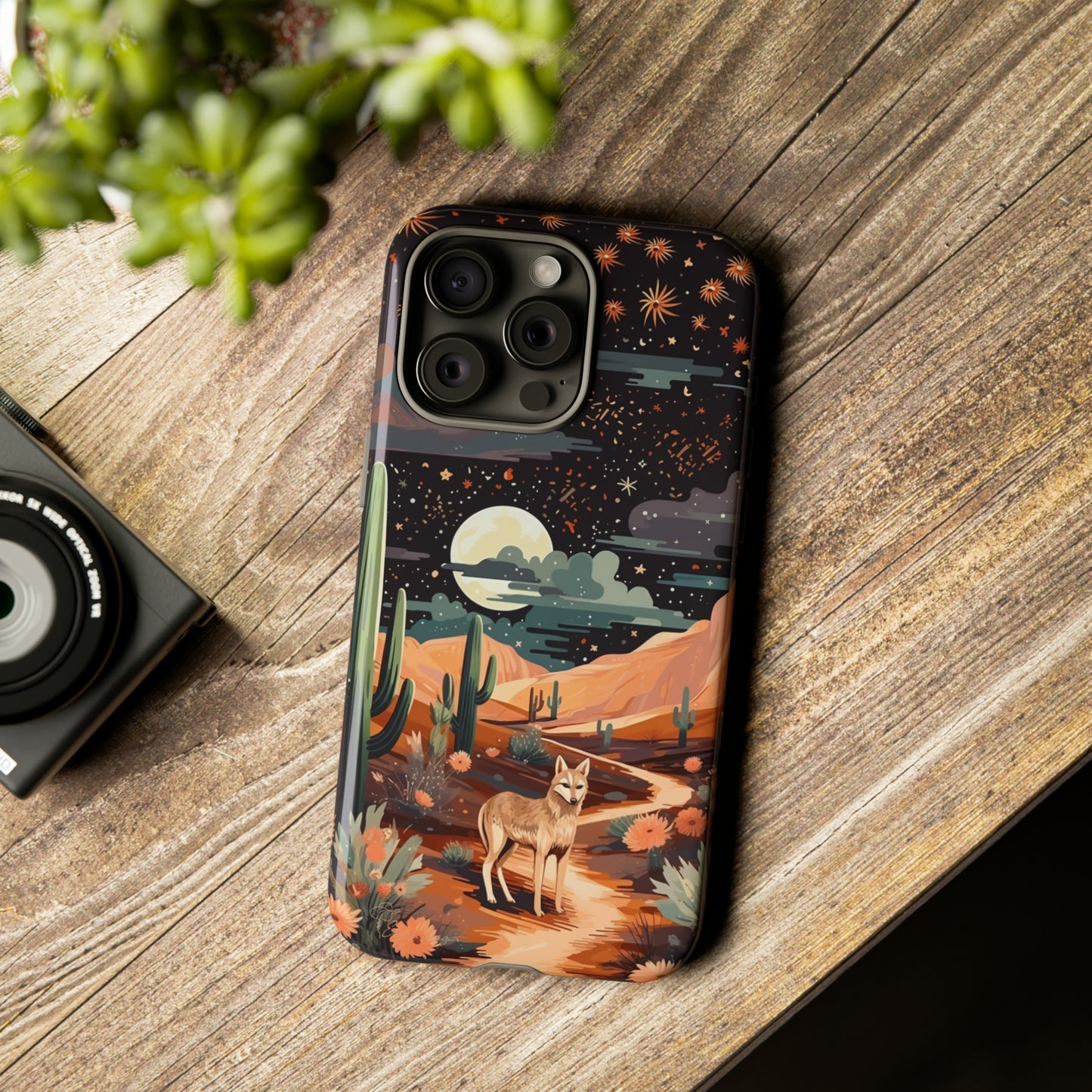 Introducing our Tough Western Cell Phone Case: Twilight Desert Jackal Remix Edition! A variation of our popular design, this edition features a jackal in a desert landscape with a starry night sky and cacti. Get ready for a unique twist on classic rugged protection.