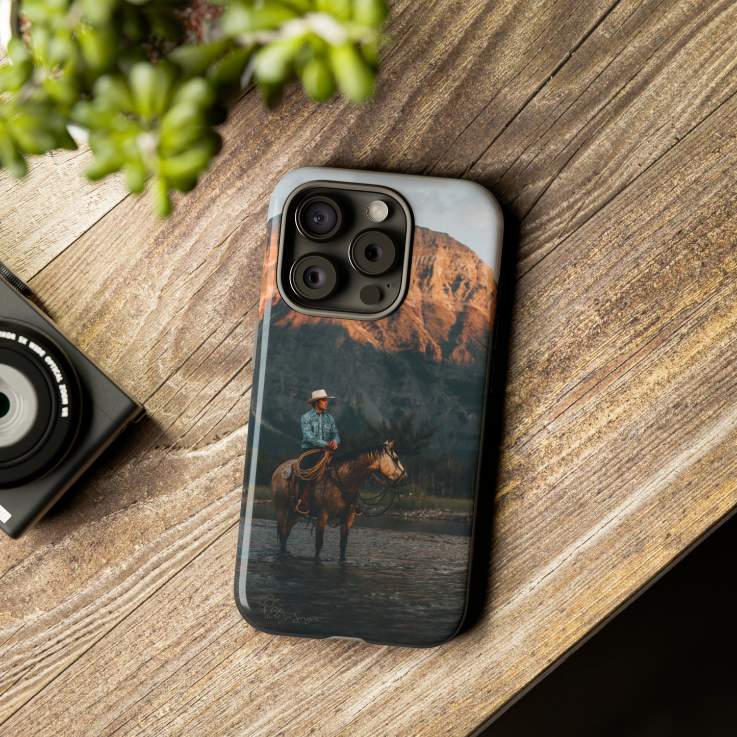 Capture the Wild: Horse Art Western Photo Yellowstone Design iPhone Tough Protective Cover. Featuring a Cowboy amidst Mountains and Buckskin hues, compatible with iPhone 15, 14, 13, XS, XR Pro/Max/Mini/P/Plus. Embrace the Spirit of the West with Style and Durability. #ElizaSinger #PhoneCase #WesternDesign