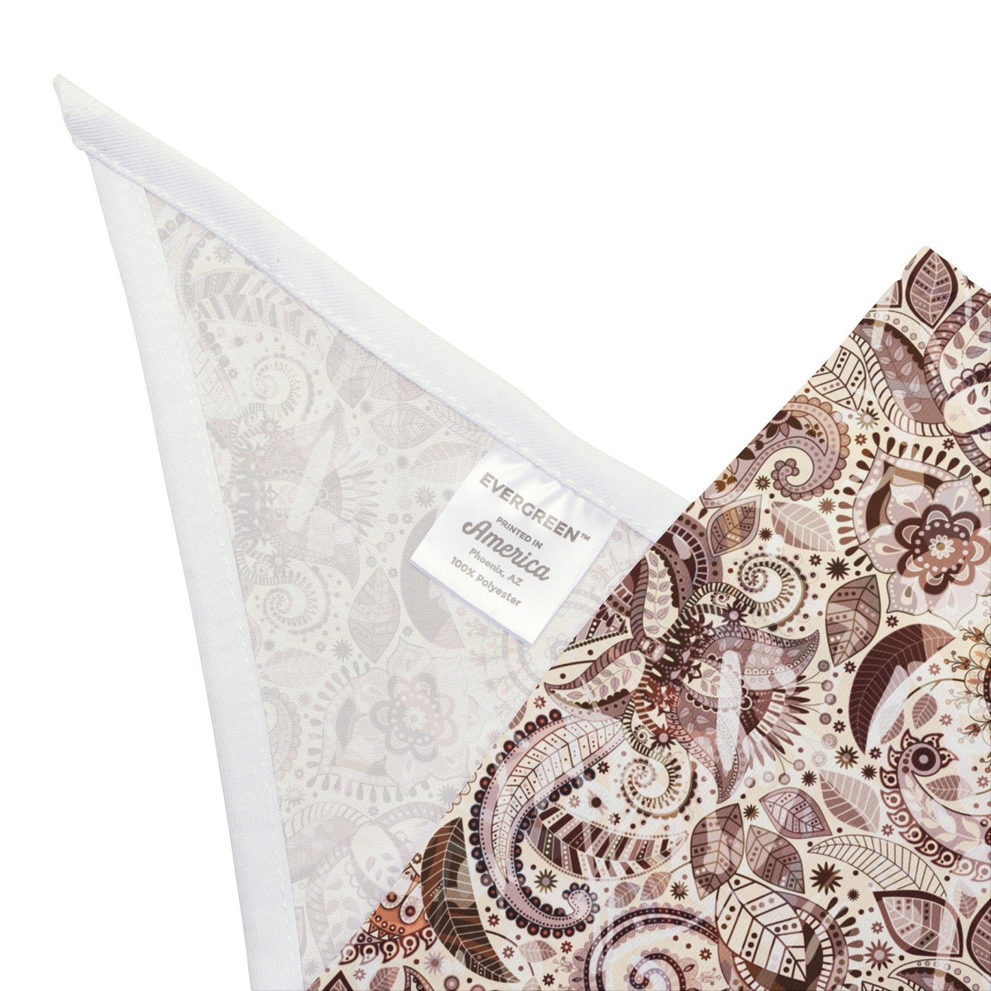 Bring a touch of warmth to your dog's look with our Sandstone Paisley Dog Bandana/Wild Rag. The light paisley design on a sand background, featuring darker shades of brown, adds a subtle and elegant touch. Crafted from soft-spun polyester, this wild rag ensures comfort and style. Make every outing a stylish affair with this exclusive design, available only at Eliza Singer.