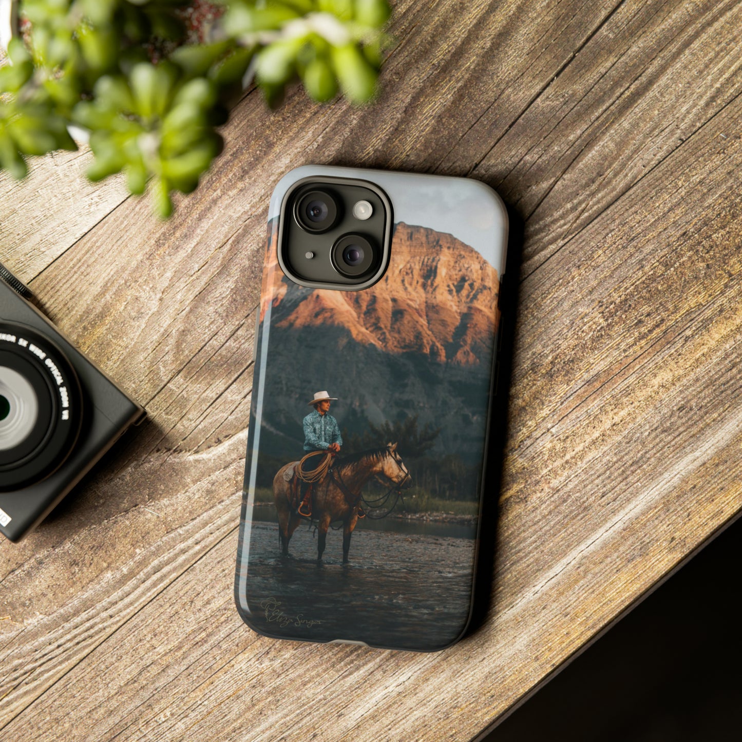 Capture the Wild: Horse Art Western Photo Yellowstone Design iPhone Tough Protective Cover. Featuring a Cowboy amidst Mountains and Buckskin hues, compatible with iPhone 15, 14, 13, XS, XR Pro/Max/Mini/P/Plus. Embrace the Spirit of the West with Style and Durability. #ElizaSinger #PhoneCase #WesternDesign