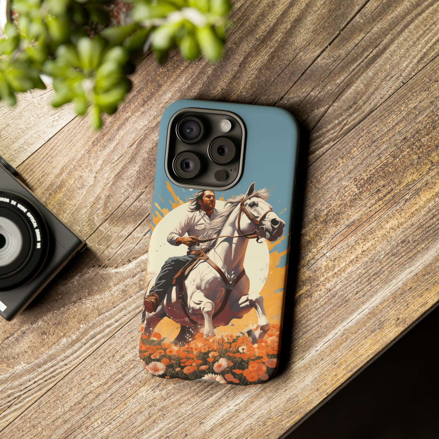 Retro Radiance Unleashed: Behold our Tough Western Cell Phone Case, featuring a vintage white horse and male rider on a vibrant turquoise backdrop. Set in a field of flowers with the sun casting a warm glow, this edition seamlessly blends style with protection. Embrace the past with this retro and stylish accessory. #ElizaSinger #PhoneCase #RetroRadiance