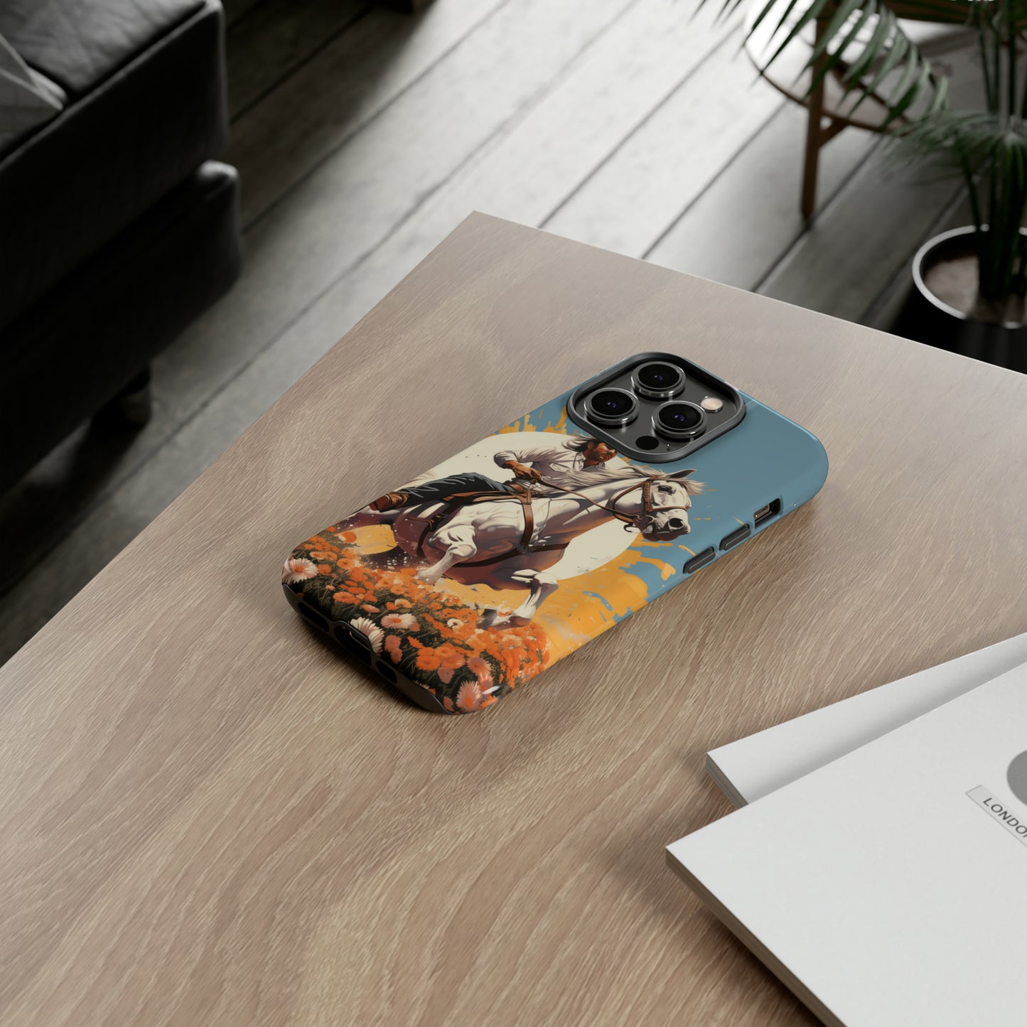 Retro Radiance Unleashed: Behold our Tough Western Cell Phone Case, featuring a vintage white horse and male rider on a vibrant turquoise backdrop. Set in a field of flowers with the sun casting a warm glow, this edition seamlessly blends style with protection. Embrace the past with this retro and stylish accessory. #ElizaSinger #PhoneCase #RetroRadiance