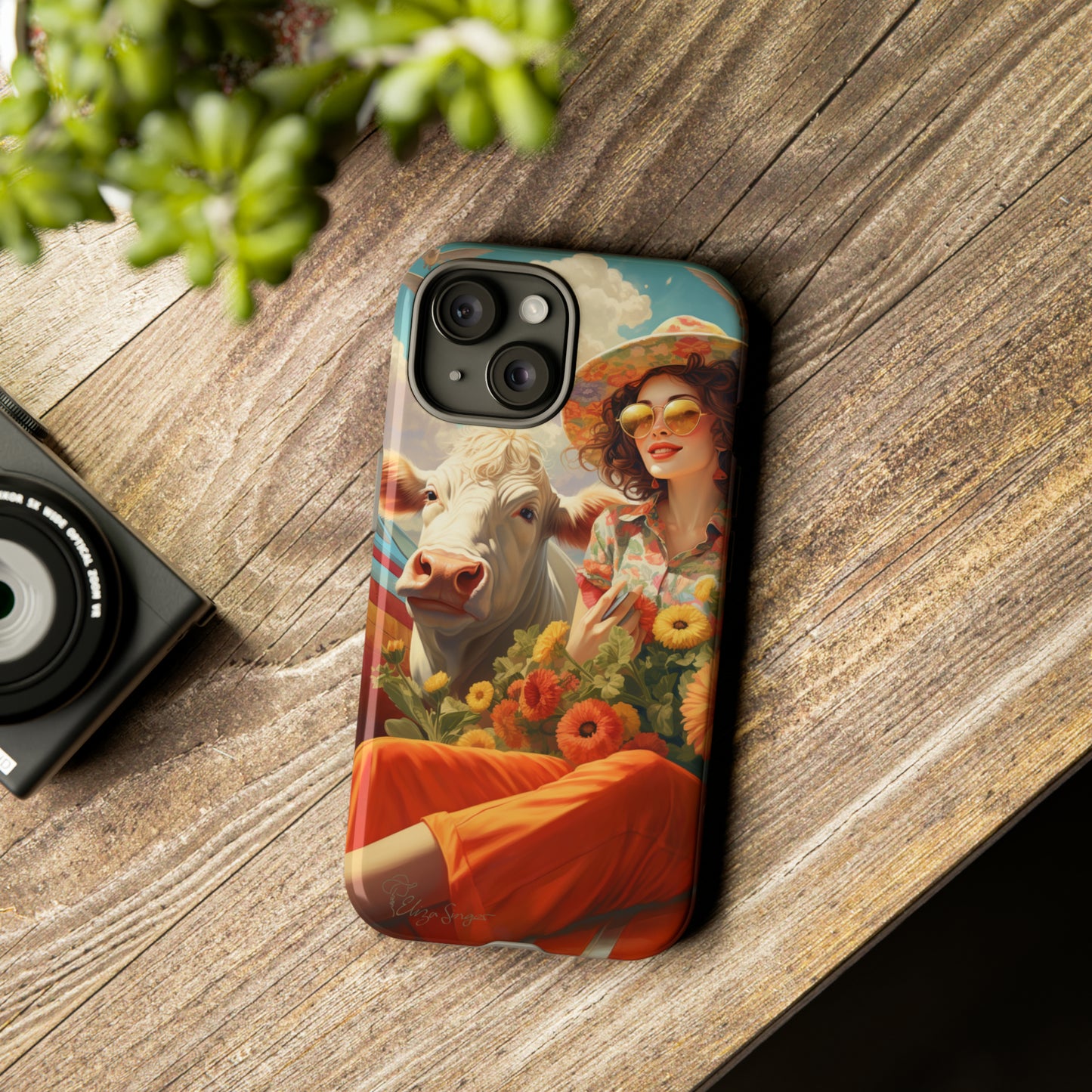 Timeless Retro Charm: Step back in time with our Tough Western Cell Phone Case. Featuring a vintage and bright design, a woman in a hat with daisies is accompanied by a cow looking over her shoulder. Experience the perfect blend of retro aesthetics and durability. Elevate your style with a touch of nostalgia. #ElizaSinger #PhoneCase #RetroStyle