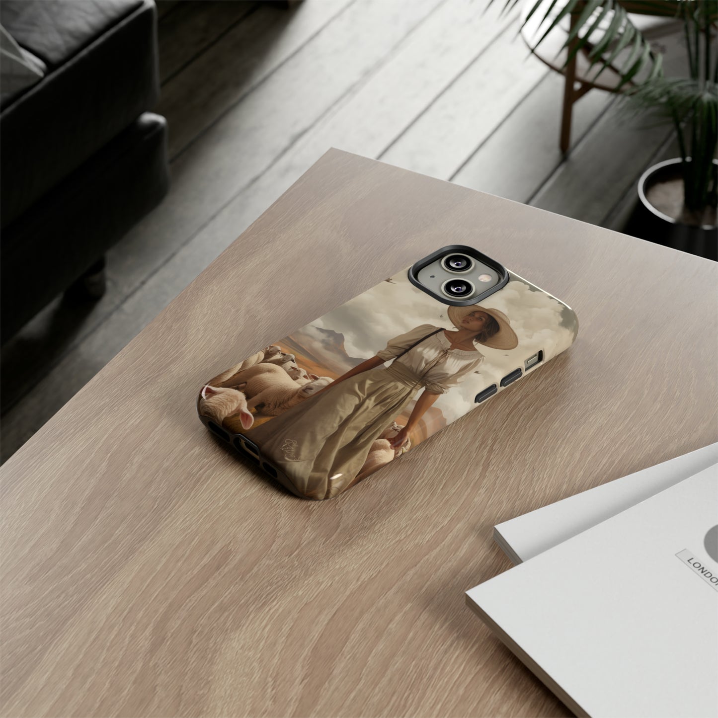 Immerse yourself in a dreamy landscape with our Tough Western Cell Phone Case showcasing a vintage painted design of a woman wearing a hat, walking through a prairie landscape with sheep behind her. Experience the magic of the past with this edition.