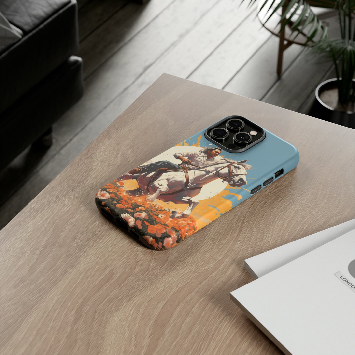 Retro Radiance Unleashed: Behold our Tough Western Cell Phone Case, featuring a vintage white horse and male rider on a vibrant turquoise backdrop. Set in a field of flowers with the sun casting a warm glow, this edition seamlessly blends style with protection. Embrace the past with this retro and stylish accessory. #ElizaSinger #PhoneCase #RetroRadiance
