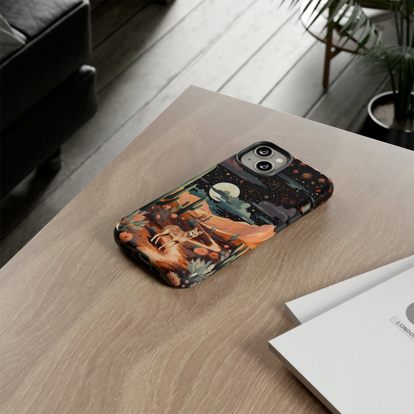 Introducing our Tough Western Cell Phone Case: Twilight Desert Jackal Remix Edition! A variation of our popular design, this edition features a jackal in a desert landscape with a starry night sky and cacti. Get ready for a unique twist on classic rugged protection.