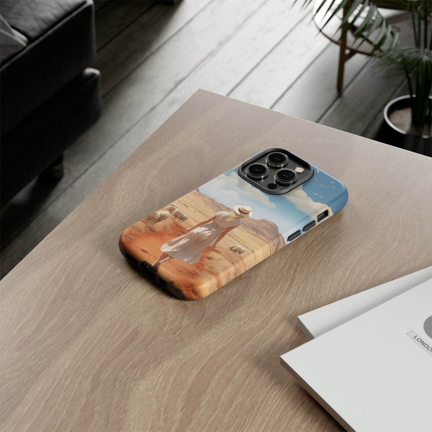 Serenity in Hand: Our Tough Western Cell Phone Case invites you to experience tranquility. A vintage painted design portrays a woman in a skirt and hat walking on a dirt road through a prairie, with grazing sheep. Let the vanishing horizon captivate your senses. Elevate your phone with timeless beauty. #ElizaSinger #PhoneCase