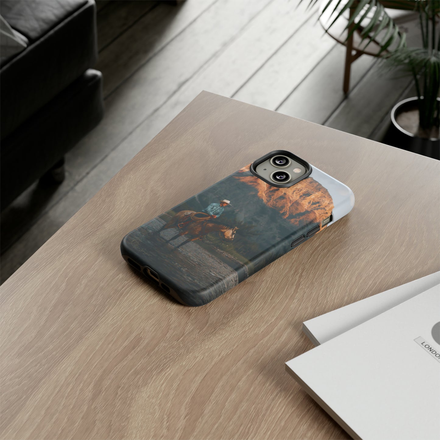 Capture the Wild: Horse Art Western Photo Yellowstone Design iPhone Tough Protective Cover. Featuring a Cowboy amidst Mountains and Buckskin hues, compatible with iPhone 15, 14, 13, XS, XR Pro/Max/Mini/P/Plus. Embrace the Spirit of the West with Style and Durability. #ElizaSinger #PhoneCase #WesternDesign