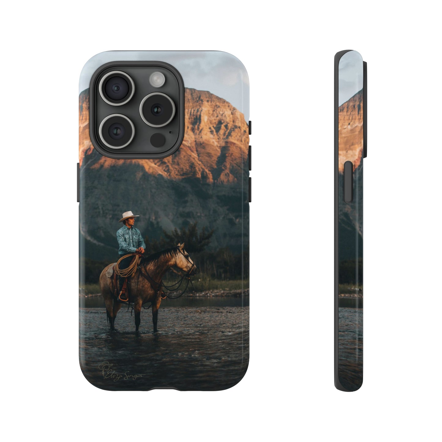 Capture the Wild: Horse Art Western Photo Yellowstone Design iPhone Tough Protective Cover. Featuring a Cowboy amidst Mountains and Buckskin hues, compatible with iPhone 15, 14, 13, XS, XR Pro/Max/Mini/P/Plus. Embrace the Spirit of the West with Style and Durability. #ElizaSinger #PhoneCase #WesternDesign