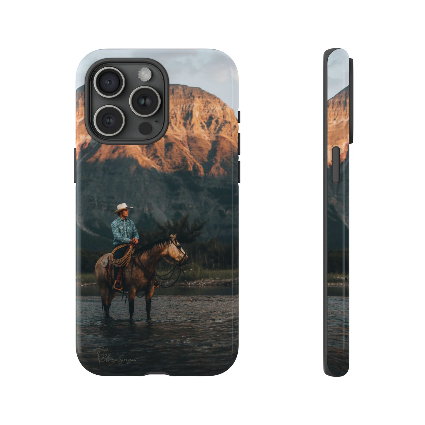 Capture the Wild: Horse Art Western Photo Yellowstone Design iPhone Tough Protective Cover. Featuring a Cowboy amidst Mountains and Buckskin hues, compatible with iPhone 15, 14, 13, XS, XR Pro/Max/Mini/P/Plus. Embrace the Spirit of the West with Style and Durability. #ElizaSinger #PhoneCase #WesternDesign