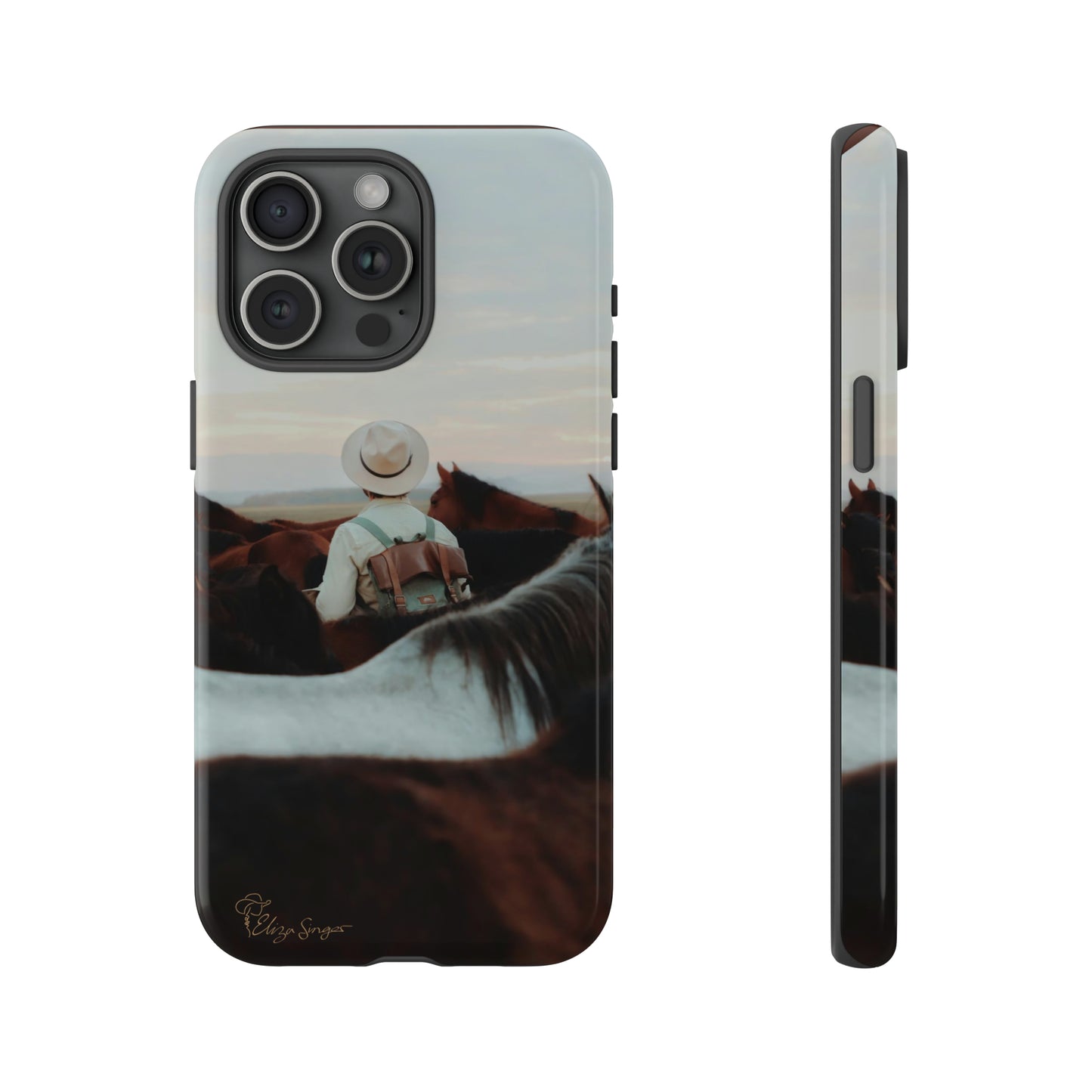 Ride into the Wild: Horse Art Western Photo Yellowstone Design iPhone Tough Protective Cover. Featuring a Cowboy amidst Mountains and Buckskin hues. Compatible with iPhone 15, 14, 13, XS, XR Pro/Max/Mini/P/Plus. Embrace the Spirit of the West with Style and Durability. #ElizaSinger #PhoneCase #WesternDesign