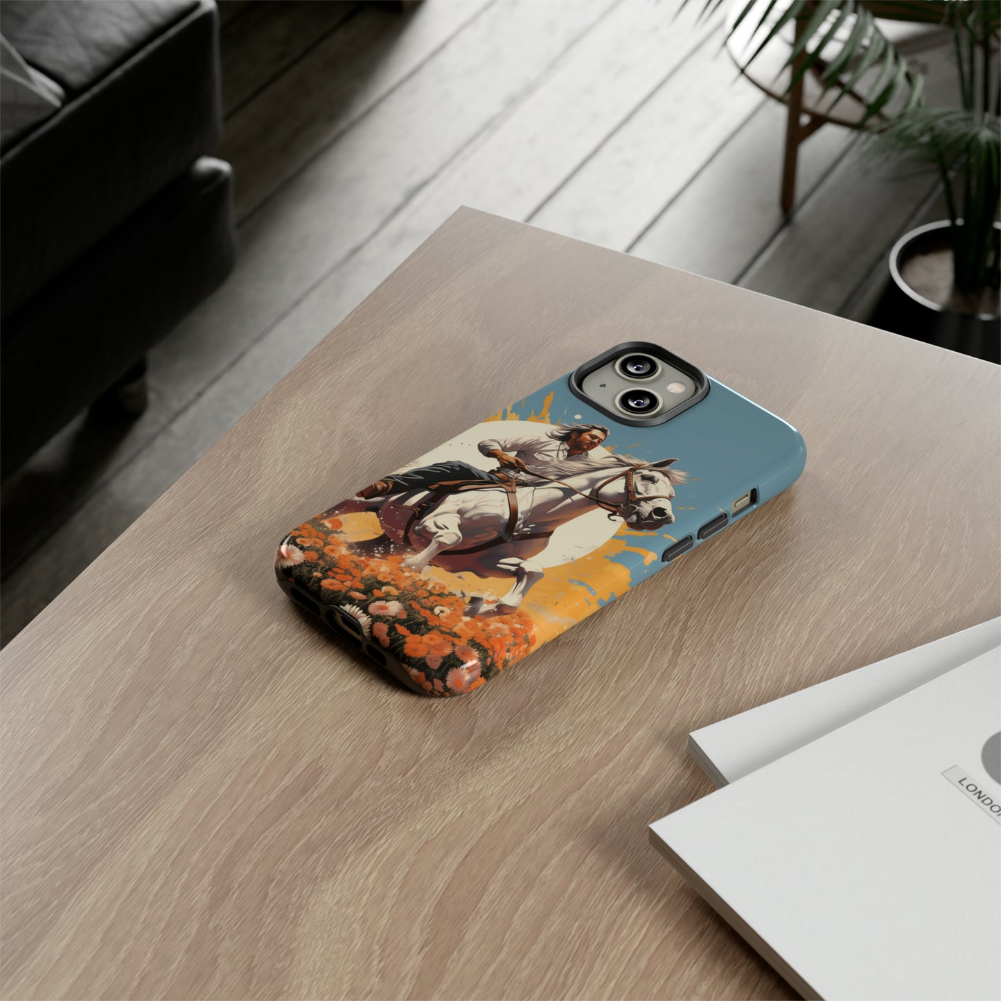 Retro Radiance Unleashed: Behold our Tough Western Cell Phone Case, featuring a vintage white horse and male rider on a vibrant turquoise backdrop. Set in a field of flowers with the sun casting a warm glow, this edition seamlessly blends style with protection. Embrace the past with this retro and stylish accessory. #ElizaSinger #PhoneCase #RetroRadiance