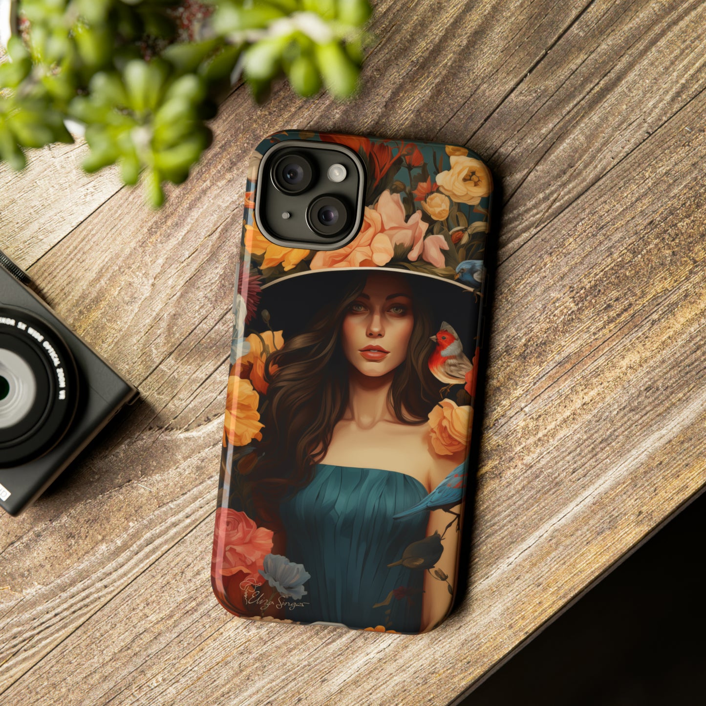 Dark Elegance Unveiled: Explore our Tough Cell Phone Case with a captivating dark background and a woman adorned with a hat amid blooming flowers. This edition seamlessly blends sophistication with robust protection, showcasing the allure of dark elegance. Elevate your style and shield your device. #ElizaSinger #PhoneCase #ElegantProtection