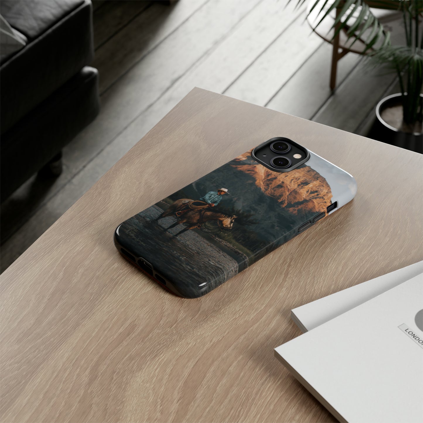 Capture the Wild: Horse Art Western Photo Yellowstone Design iPhone Tough Protective Cover. Featuring a Cowboy amidst Mountains and Buckskin hues, compatible with iPhone 15, 14, 13, XS, XR Pro/Max/Mini/P/Plus. Embrace the Spirit of the West with Style and Durability. #ElizaSinger #PhoneCase #WesternDesign