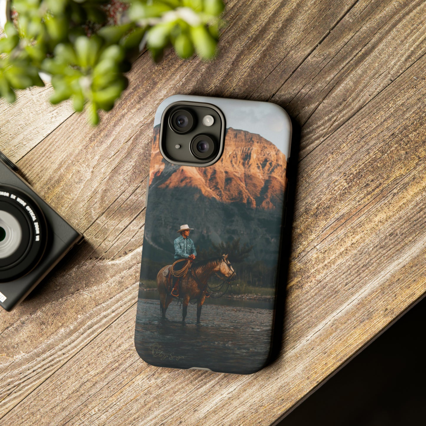 Capture the Wild: Horse Art Western Photo Yellowstone Design iPhone Tough Protective Cover. Featuring a Cowboy amidst Mountains and Buckskin hues, compatible with iPhone 15, 14, 13, XS, XR Pro/Max/Mini/P/Plus. Embrace the Spirit of the West with Style and Durability. #ElizaSinger #PhoneCase #WesternDesign