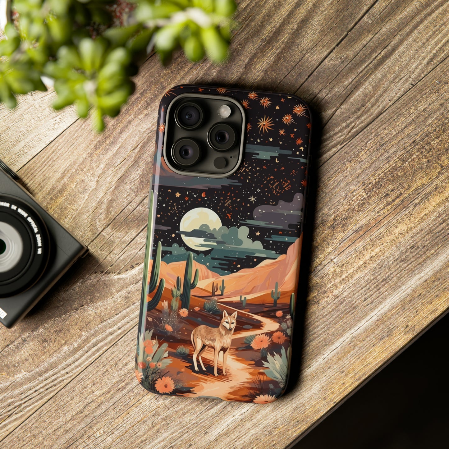 Unveiling our Tough Western Cell Phone Case: Stellar Desert Jackal Edition! Embrace the beauty of the night with a jackal in a desert landscape, under a starry sky, surrounded by cacti. This case provides rugged protection with a touch of celestial elegance.