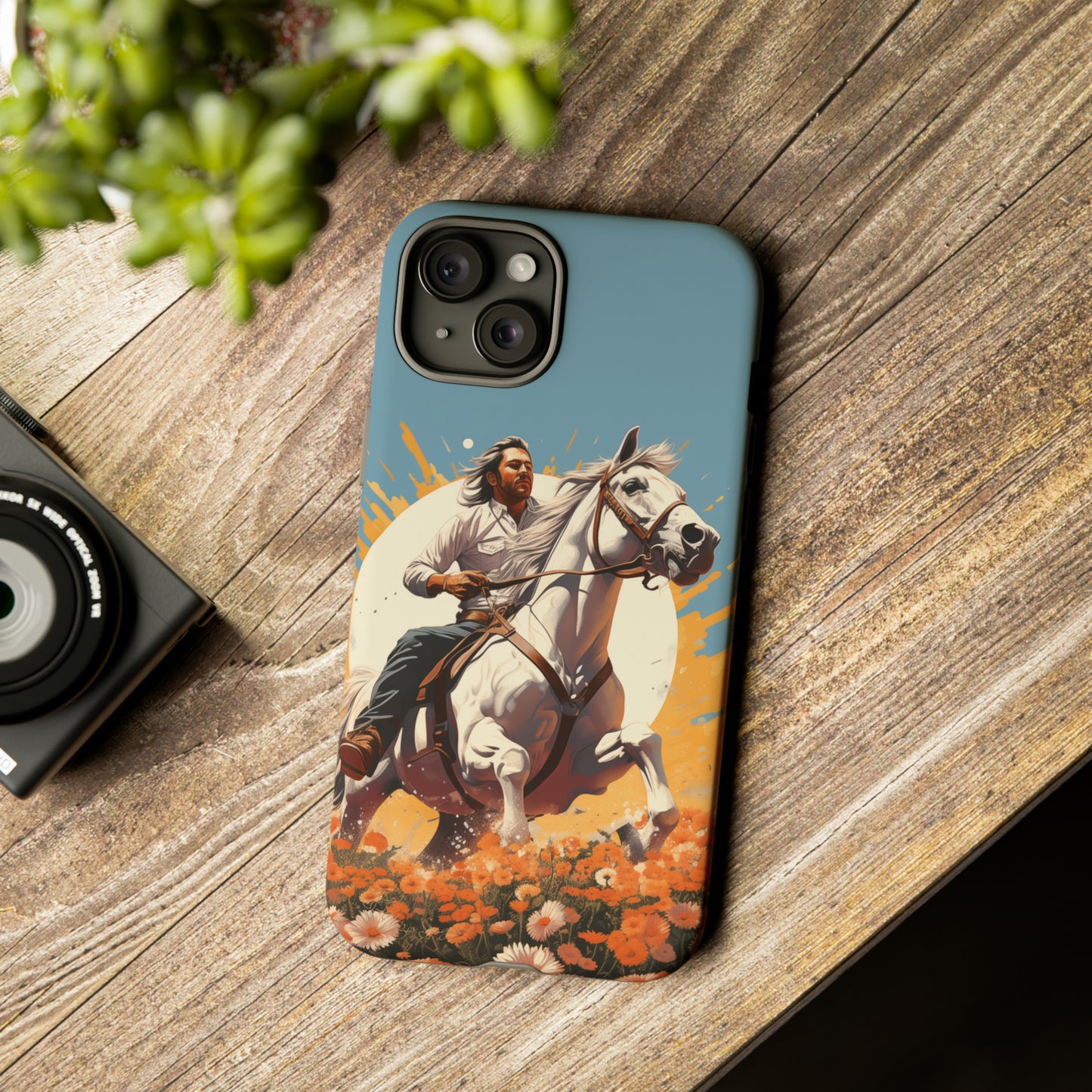 Retro Radiance Unleashed: Behold our Tough Western Cell Phone Case, featuring a vintage white horse and male rider on a vibrant turquoise backdrop. Set in a field of flowers with the sun casting a warm glow, this edition seamlessly blends style with protection. Embrace the past with this retro and stylish accessory. #ElizaSinger #PhoneCase #RetroRadiance