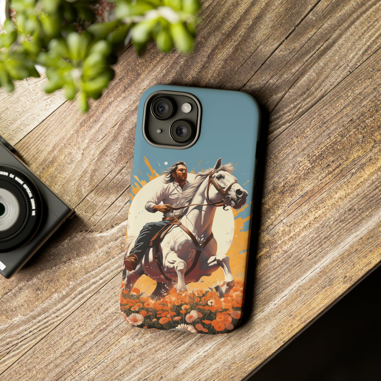 Retro Radiance Unleashed: Behold our Tough Western Cell Phone Case, featuring a vintage white horse and male rider on a vibrant turquoise backdrop. Set in a field of flowers with the sun casting a warm glow, this edition seamlessly blends style with protection. Embrace the past with this retro and stylish accessory. #ElizaSinger #PhoneCase #RetroRadiance
