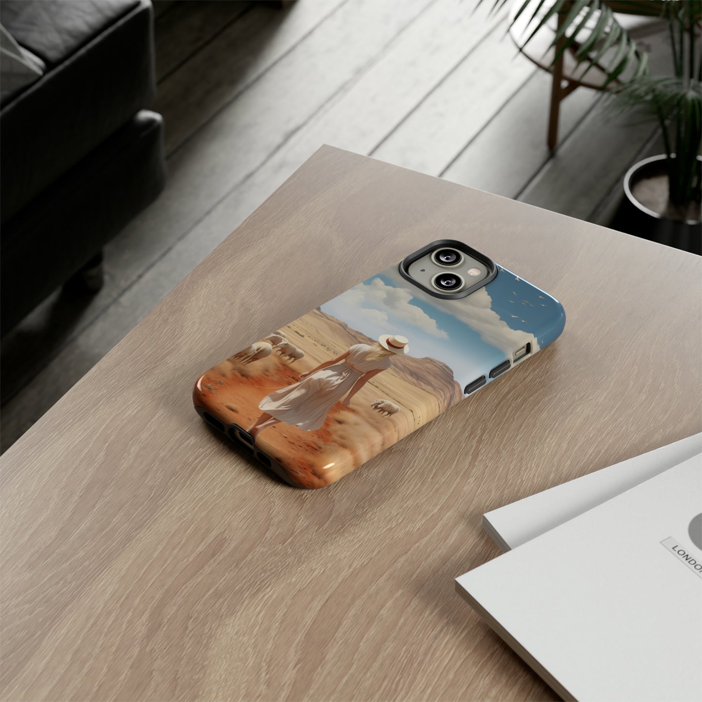 Serenity in Hand: Our Tough Western Cell Phone Case invites you to experience tranquility. A vintage painted design portrays a woman in a skirt and hat walking on a dirt road through a prairie, with grazing sheep. Let the vanishing horizon captivate your senses. Elevate your phone with timeless beauty. #ElizaSinger #PhoneCase