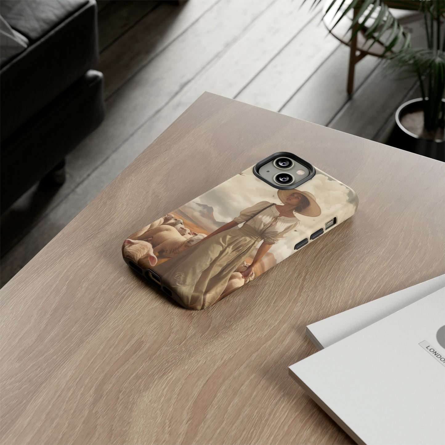 Immerse yourself in a dreamy landscape with our Tough Western Cell Phone Case showcasing a vintage painted design of a woman wearing a hat, walking through a prairie landscape with sheep behind her. Experience the magic of the past with this edition.