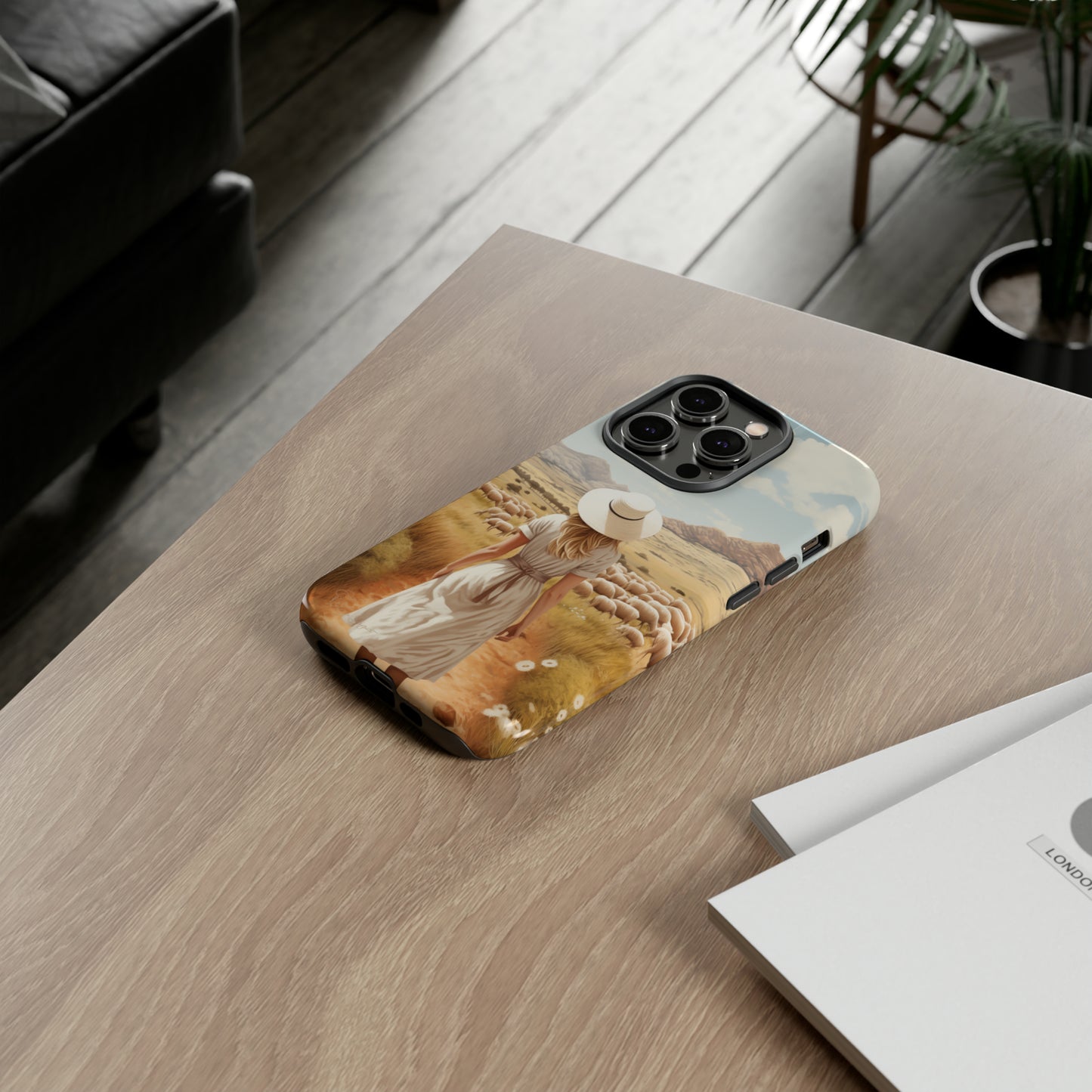 Dreamy Nostalgia: Immerse yourself in a vintage painted landscape with our Tough Western Cell Phone Case. Adorned with a woman in a hat strolling through a prairie with sheep, this edition captures the magic of the past. Elevate your phone with timeless charm. #ElizaSinger #PhoneCase