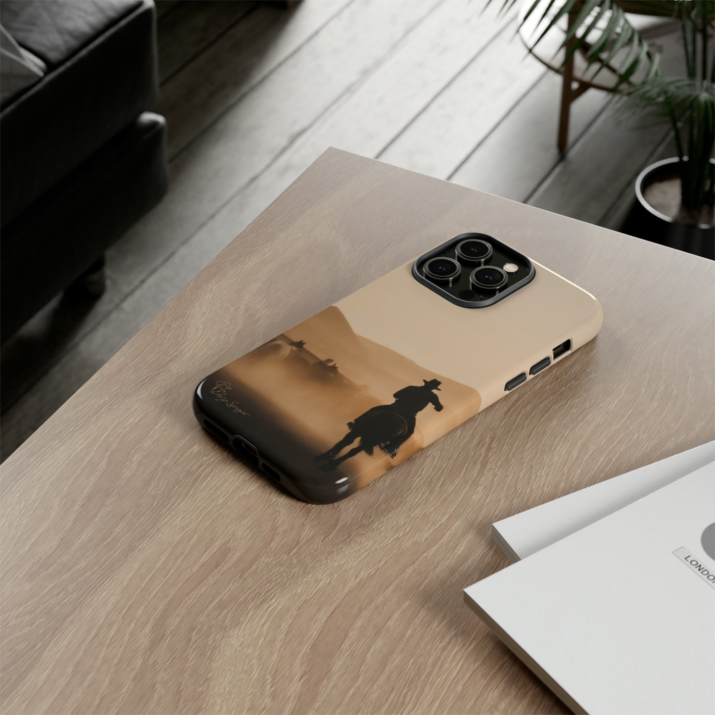 Capture the Western Spirit: Horse Art Western Photo Yellowstone Design iPhone Tough Protective Cover. Featuring a Cowboy amidst Mountains and Buckskin hues. Compatible with iPhone 15, 14, 13, XS, XR Pro/Max/Mini/P/Plus. Bring the Wild West to Your Device with Style and Durability. #ElizaSinger #PhoneCase #WesternDesign