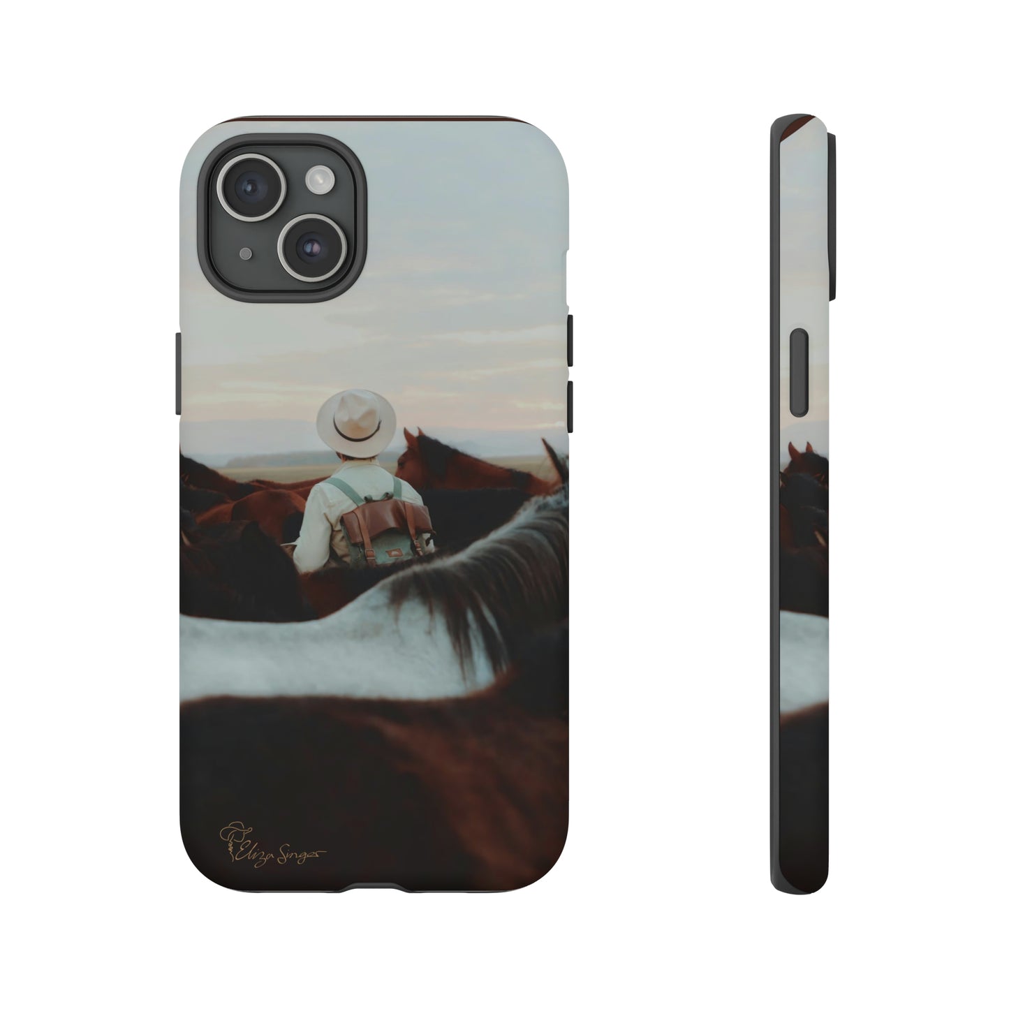 Ride into the Wild: Horse Art Western Photo Yellowstone Design iPhone Tough Protective Cover. Featuring a Cowboy amidst Mountains and Buckskin hues. Compatible with iPhone 15, 14, 13, XS, XR Pro/Max/Mini/P/Plus. Embrace the Spirit of the West with Style and Durability. #ElizaSinger #PhoneCase #WesternDesign