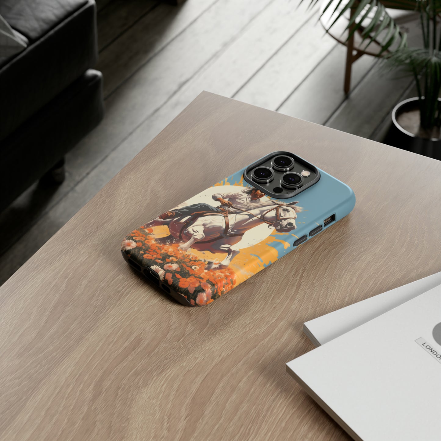 Retro Radiance Unleashed: Behold our Tough Western Cell Phone Case, featuring a vintage white horse and male rider on a vibrant turquoise backdrop. Set in a field of flowers with the sun casting a warm glow, this edition seamlessly blends style with protection. Embrace the past with this retro and stylish accessory. #ElizaSinger #PhoneCase #RetroRadiance