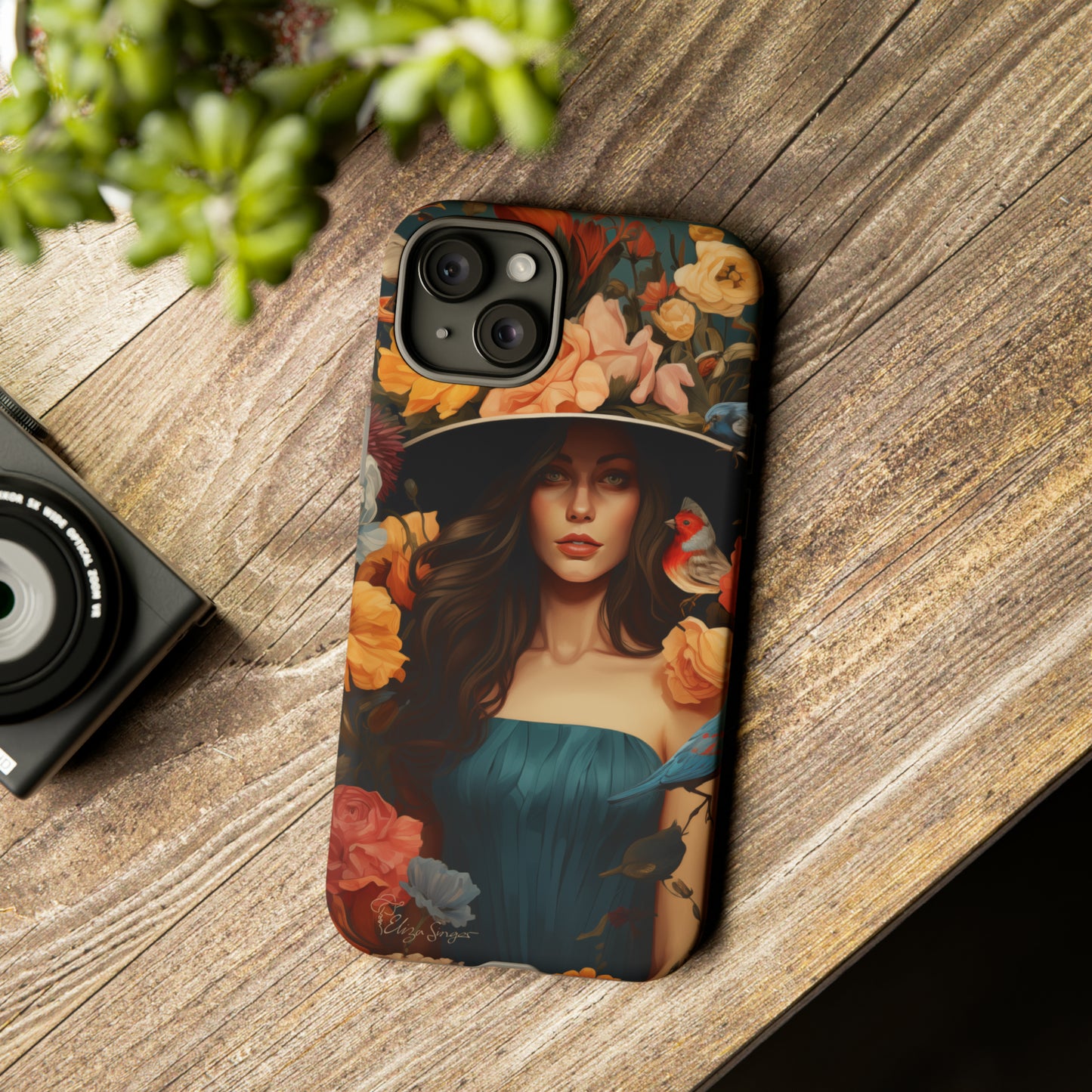 Dark Elegance Unveiled: Explore our Tough Cell Phone Case with a captivating dark background and a woman adorned with a hat amid blooming flowers. This edition seamlessly blends sophistication with robust protection, showcasing the allure of dark elegance. Elevate your style and shield your device. #ElizaSinger #PhoneCase #ElegantProtection