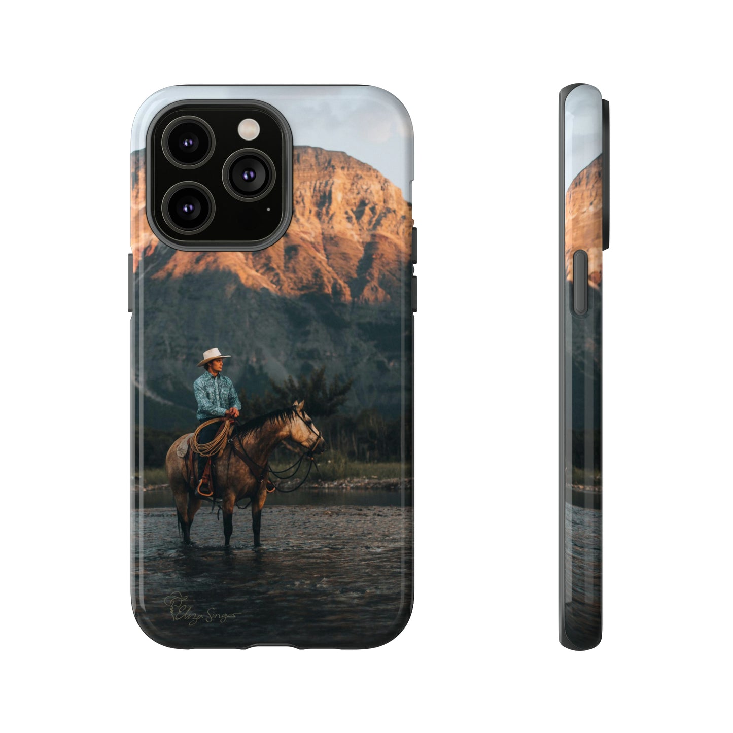 Capture the Wild: Horse Art Western Photo Yellowstone Design iPhone Tough Protective Cover. Featuring a Cowboy amidst Mountains and Buckskin hues, compatible with iPhone 15, 14, 13, XS, XR Pro/Max/Mini/P/Plus. Embrace the Spirit of the West with Style and Durability. #ElizaSinger #PhoneCase #WesternDesign