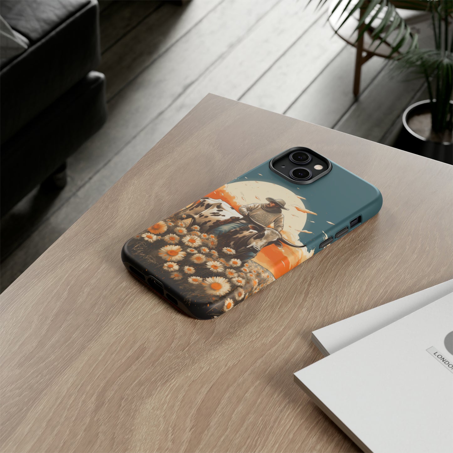 Harmony of Contrasts: Dive into our Tough Cell Phone Case, a visual symphony featuring a bullrider on a black and white dairy cow amidst a vibrant field of flowers. This edition effortlessly merges toughness with artistic flair, offering a unique and captivating contrast. Elevate your phone with rugged elegance. #ElizaSinger #PhoneCase #ContrastHarmony