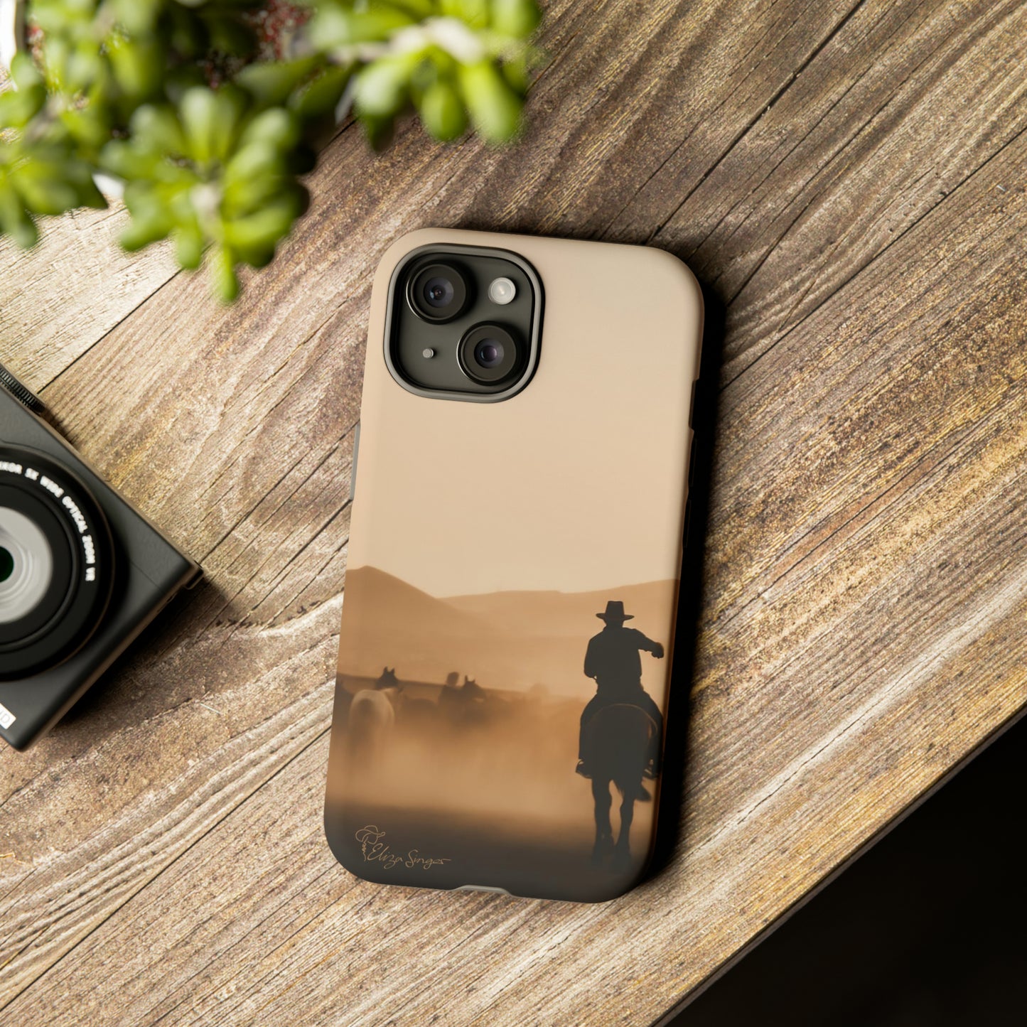 Capture the Western Spirit: Horse Art Western Photo Yellowstone Design iPhone Tough Protective Cover. Featuring a Cowboy amidst Mountains and Buckskin hues. Compatible with iPhone 15, 14, 13, XS, XR Pro/Max/Mini/P/Plus. Bring the Wild West to Your Device with Style and Durability. #ElizaSinger #PhoneCase #WesternDesign