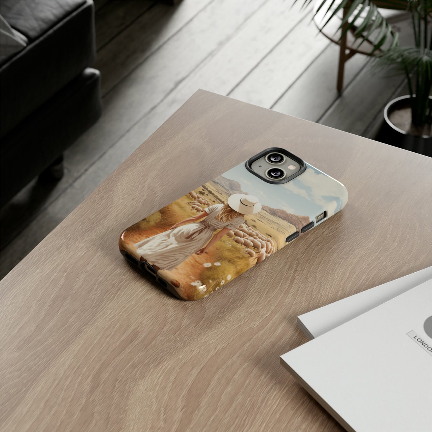 Dreamy Nostalgia: Immerse yourself in a vintage painted landscape with our Tough Western Cell Phone Case. Adorned with a woman in a hat strolling through a prairie with sheep, this edition captures the magic of the past. Elevate your phone with timeless charm. #ElizaSinger #PhoneCase