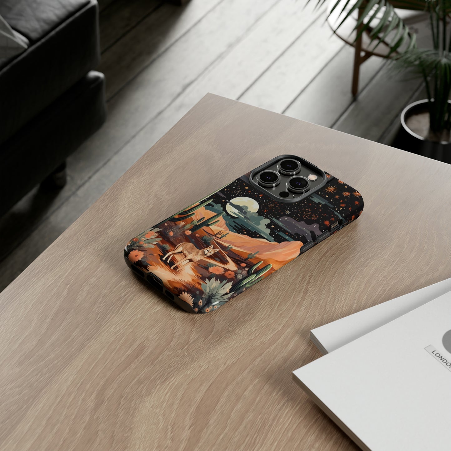 Unveiling our Tough Western Cell Phone Case: Stellar Desert Jackal Edition! Embrace the beauty of the night with a jackal in a desert landscape, under a starry sky, surrounded by cacti. This case provides rugged protection with a touch of celestial elegance.