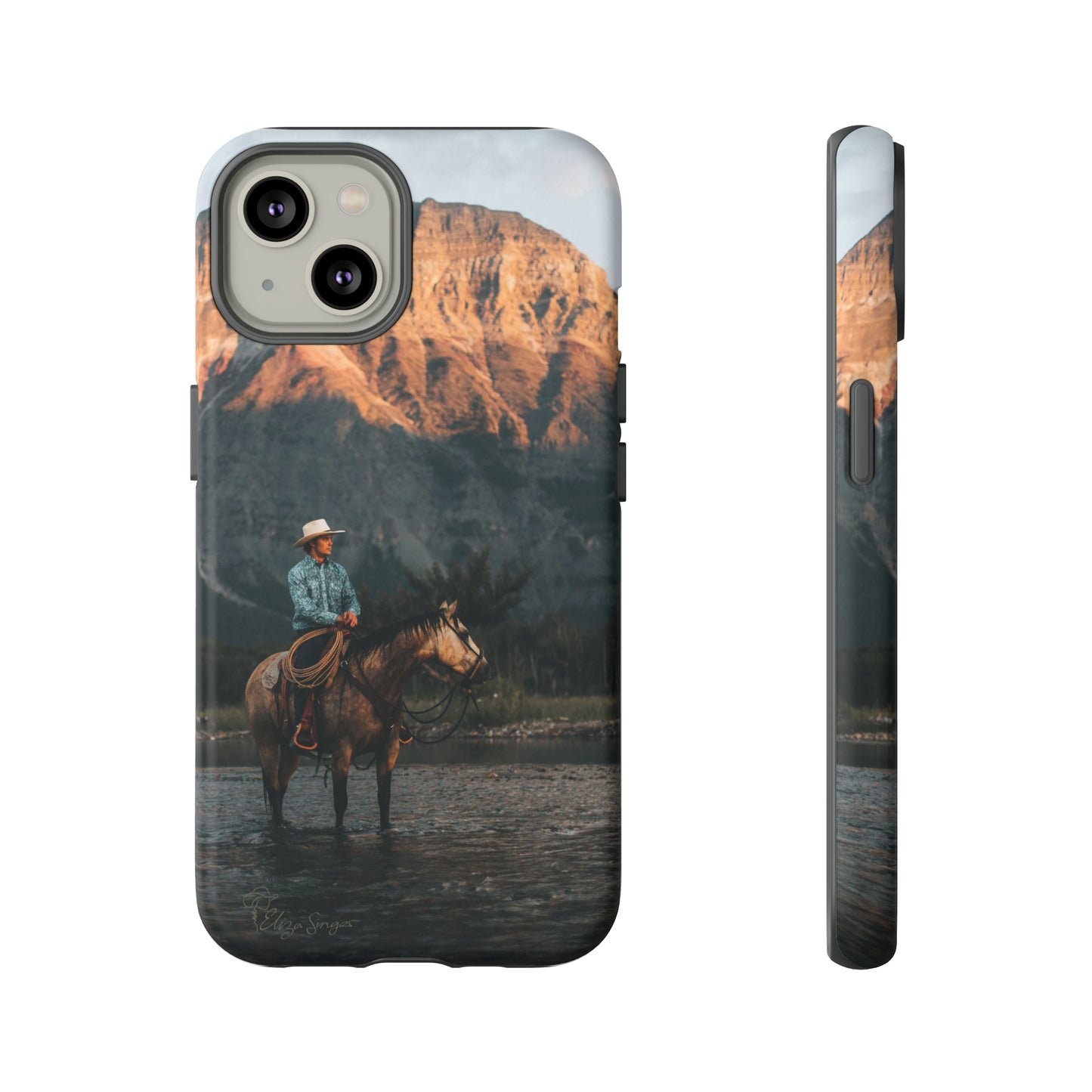 Capture the Wild: Horse Art Western Photo Yellowstone Design iPhone Tough Protective Cover. Featuring a Cowboy amidst Mountains and Buckskin hues, compatible with iPhone 15, 14, 13, XS, XR Pro/Max/Mini/P/Plus. Embrace the Spirit of the West with Style and Durability. #ElizaSinger #PhoneCase #WesternDesign